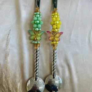 BOMBAS INOX TRANÇADAS COM BORBOLETA PEQUENA E FLOR DE PEROLA