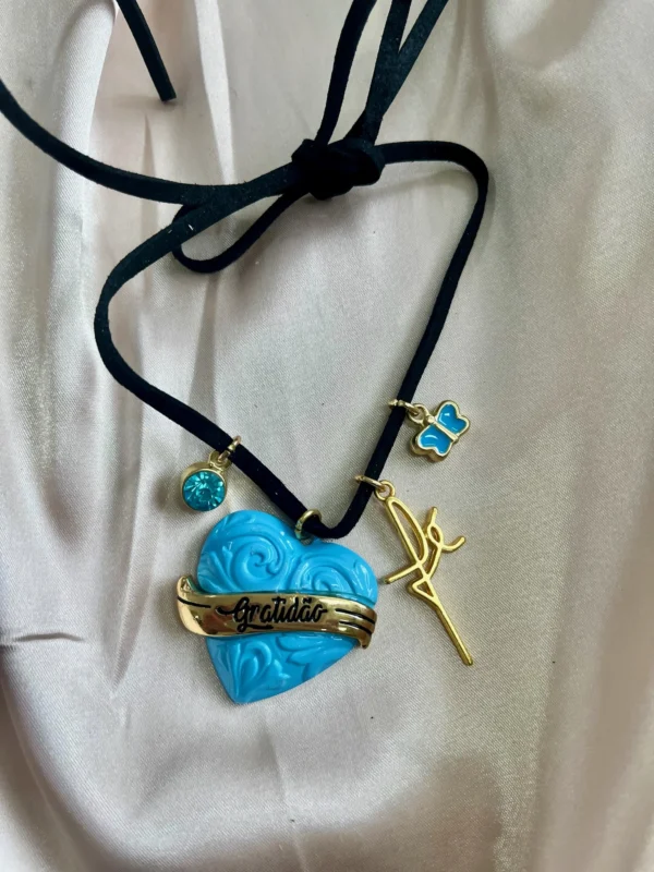 CÓD 224 PULSEIRA DE CUIA CORDINHA DE COURO COM PINGENTE